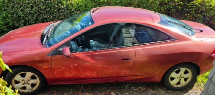 red 1999 mercury cougar car with two doors and a hatchback for sale at Shelton online auction with Blue Nest Home